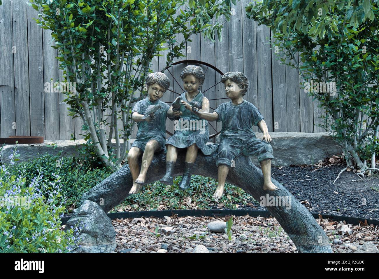 A front shot of the Three boys statue at Deanna Rose Children's Farmstead in Overland Park Kansas Stock Photo