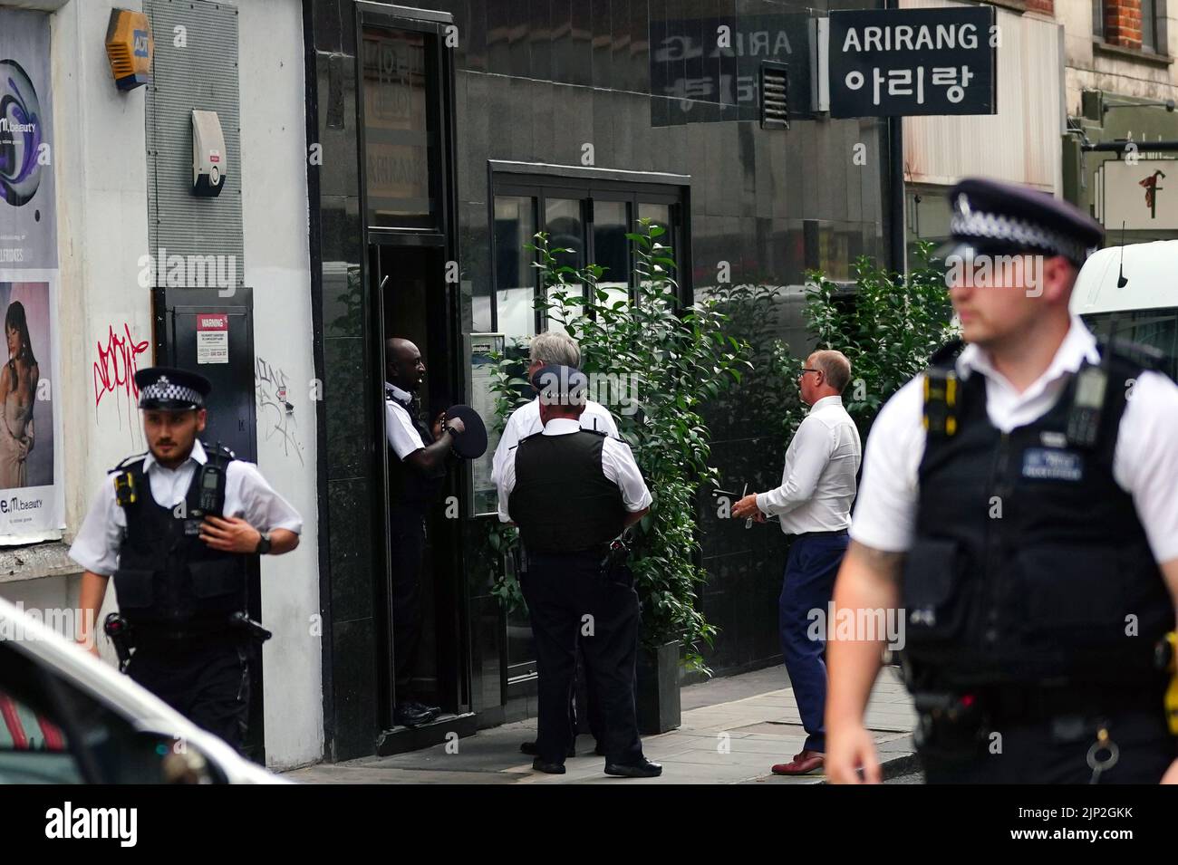 Police n Poland Street, central London, as a man has been stabbed to