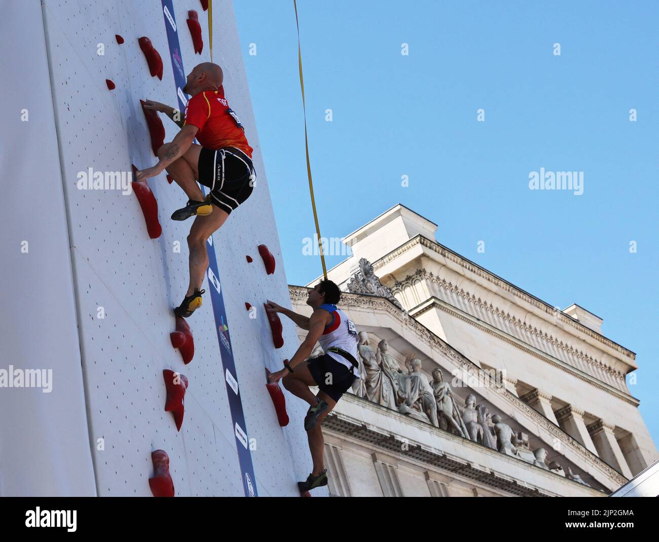 2022 European Championships - Sport Climbing - Konigsplatz, Munich, Germany - August 15, 2022 Spain's Erik Paulo Noya Cardon and Italy's Alessandro Boulos in action during the men's speed final REUTERS/Wolfgang Rattay Stock Photo