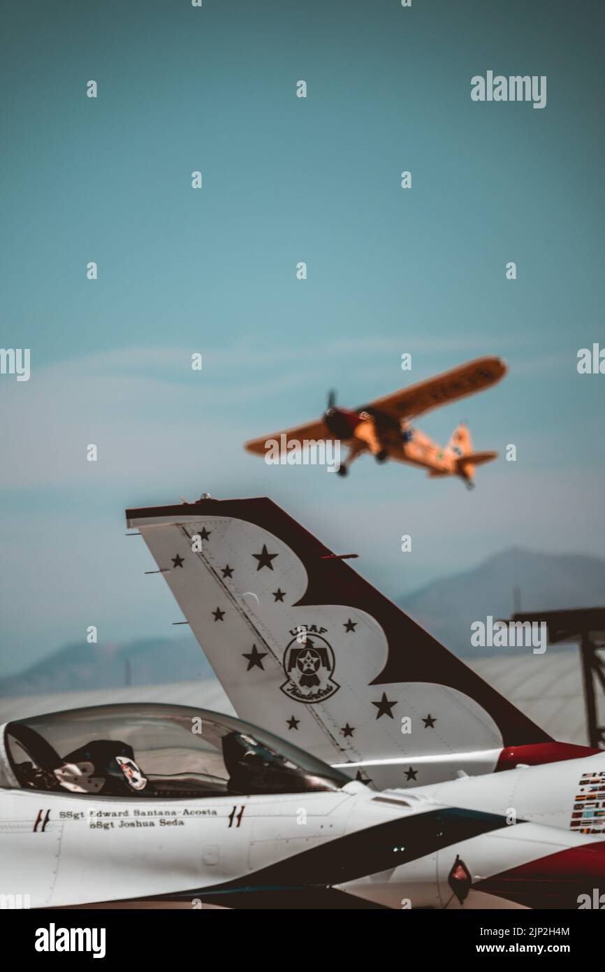 A vertical shot of fighter jets on the ground and in the air at Holloman AFB Air Show, Alamogordo NM Stock Photo