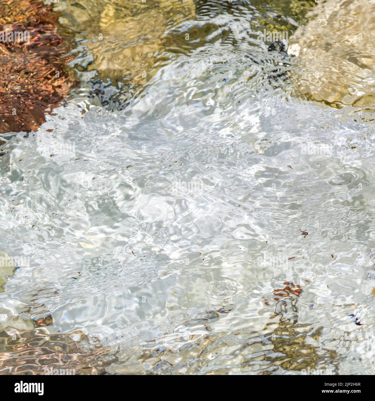 Moving water over marble pebble beach, Thassos, Macedonia, North-Eastern France Stock Photo