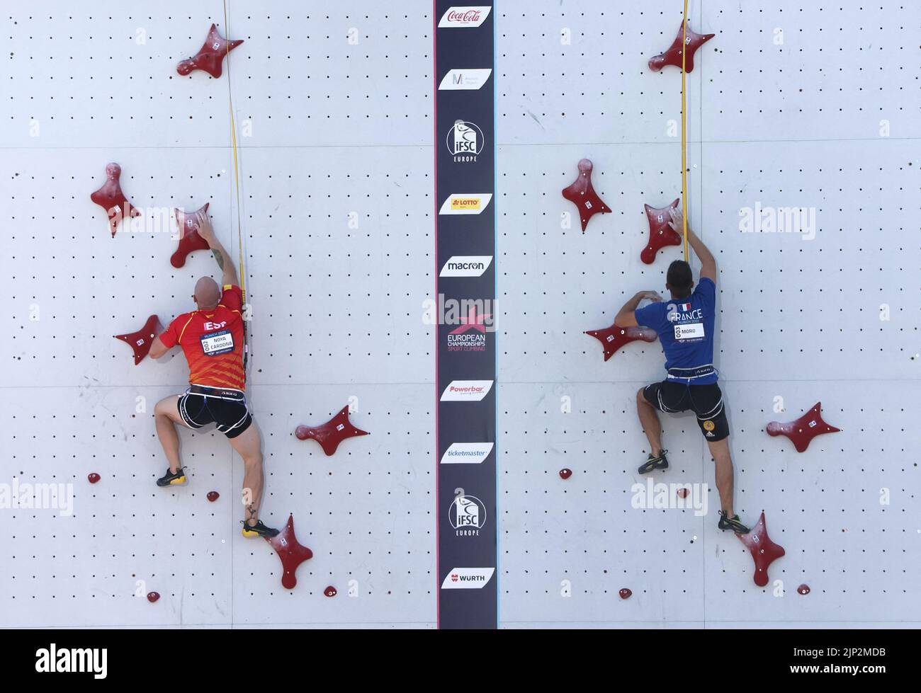 2022 European Championships - Sport Climbing - Konigsplatz, Munich, Germany - August 15, 2022 France's Guillaume Moro and Spain's Erik Paulo Noya Cardona in action during the men's speed small final REUTERS/Wolfgang Rattay Stock Photo