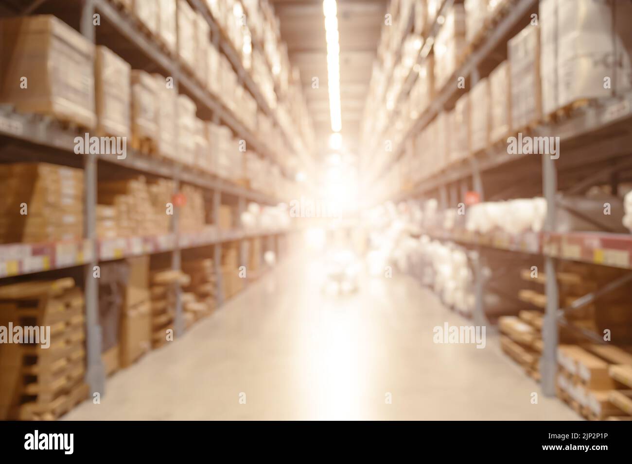 Blur large warehouse products goods stock factory inventory storage ...