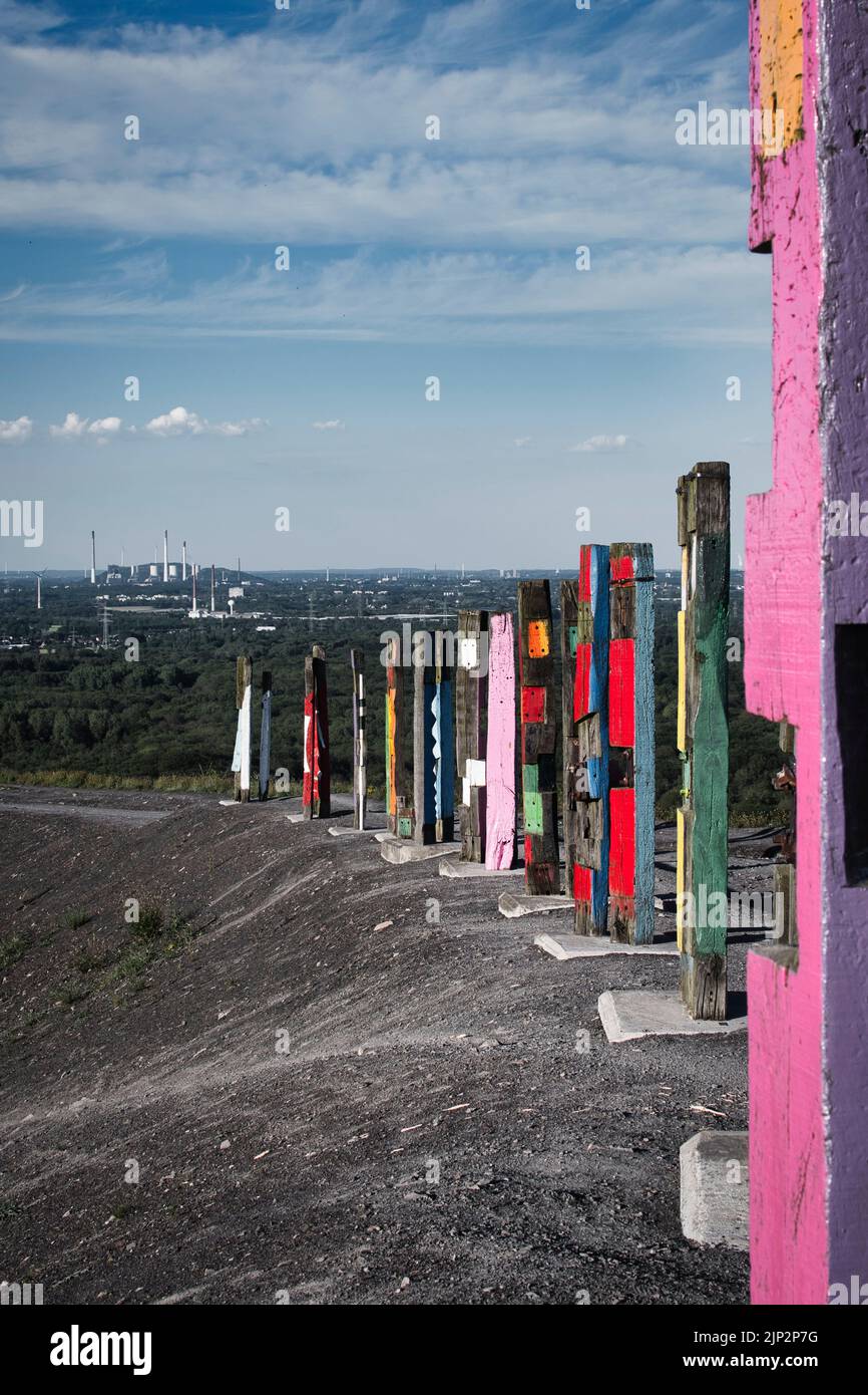 A vertical shot of an art installation made of colored piles on the Haniel slagheap in the Ruhr area in Germany Stock Photo