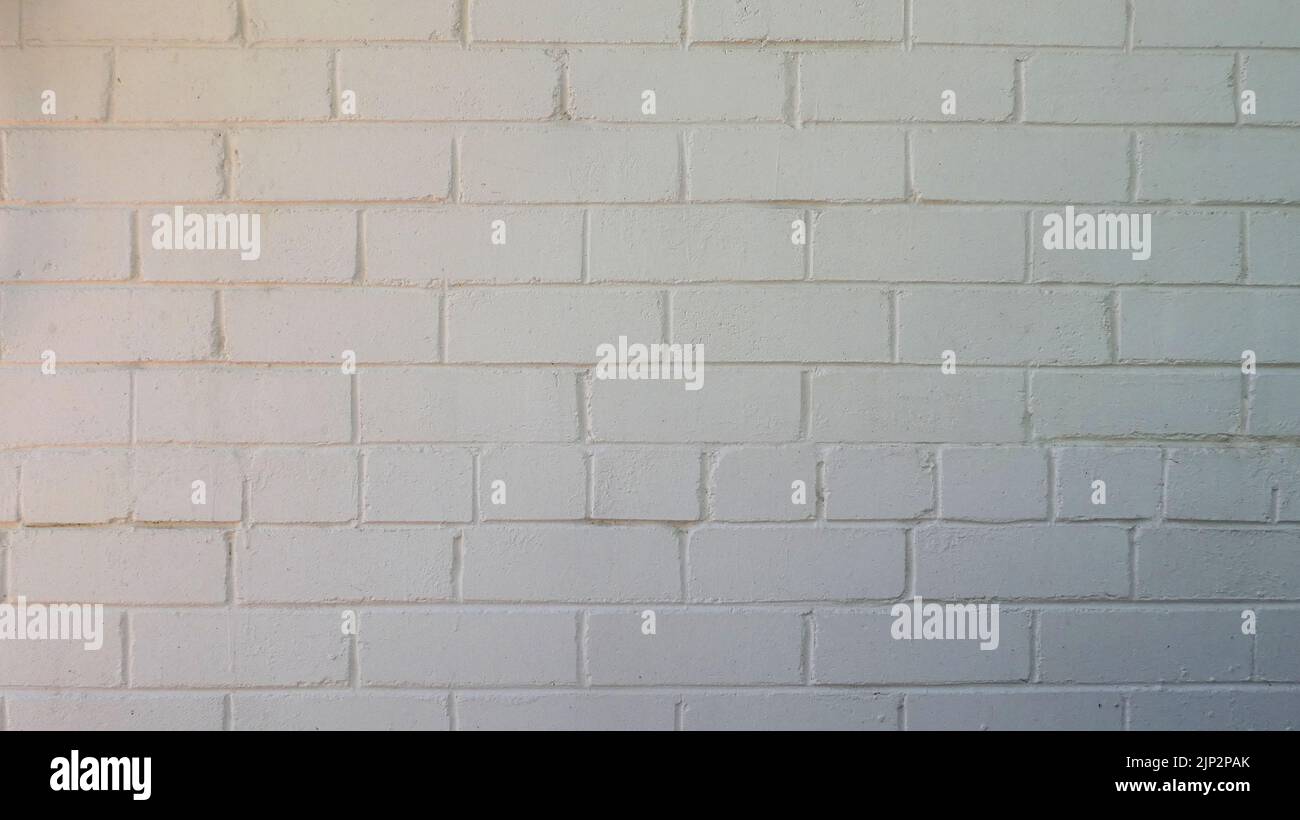 off white color painted brick wall background with space for text Stock Photo