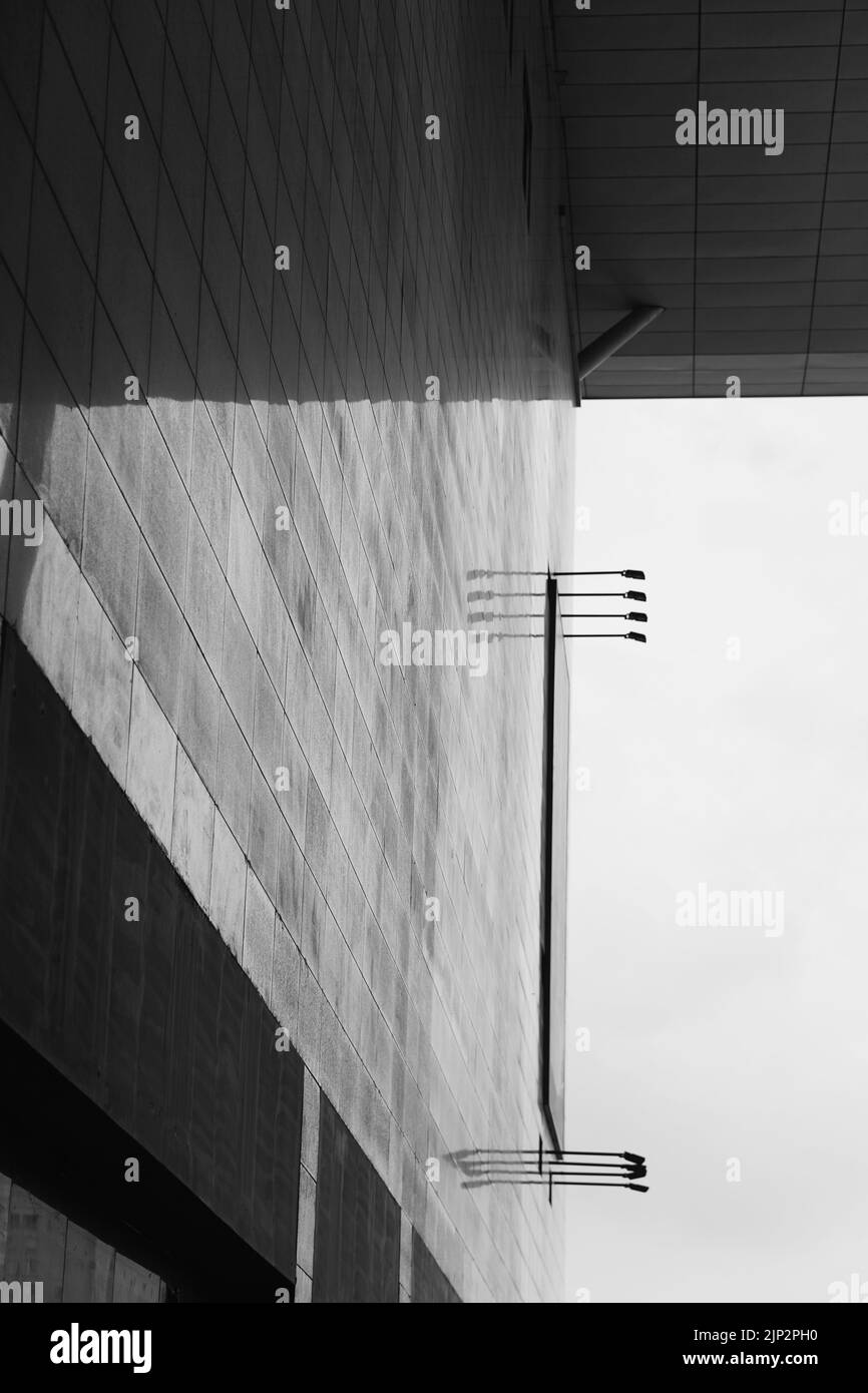 A vertical grayscale shot of a building's flat wall Stock Photo - Alamy