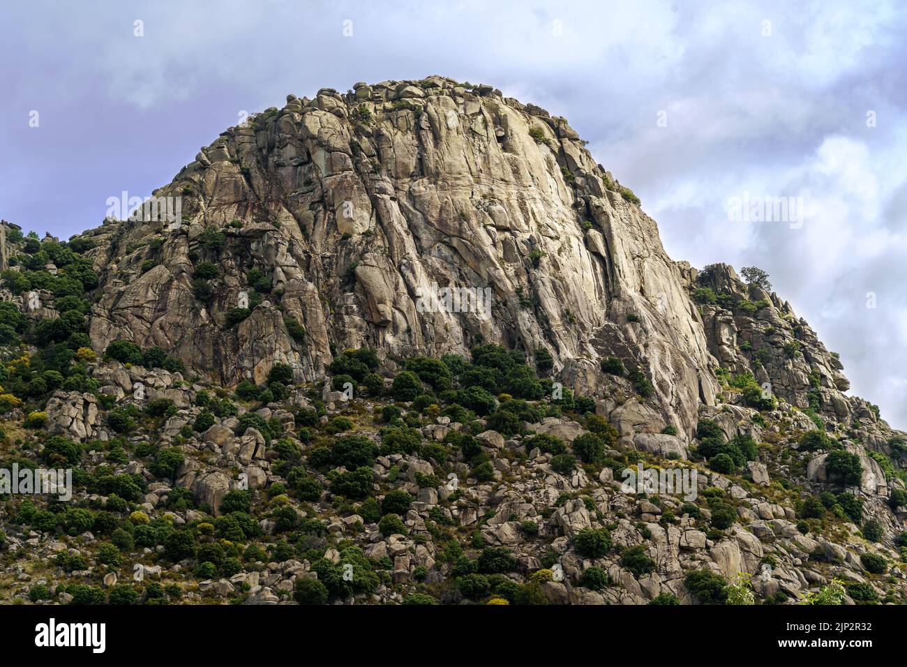 Rocky mountain landscape, vertical wall for climbing. Pico de la Miel. The Cabrera. Madrid. Stock Photo