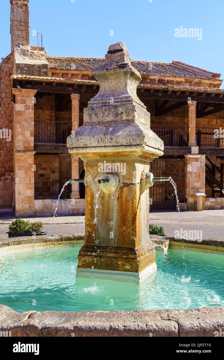 Water fountain in the village square. Ayllon Segovia Spain. Stock Photo