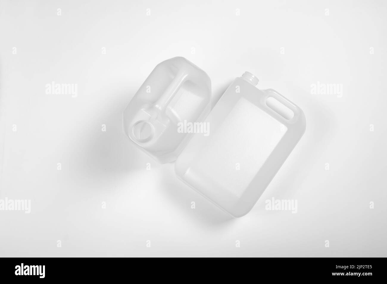 A top view of a plastic canisters on a white background with gray shade