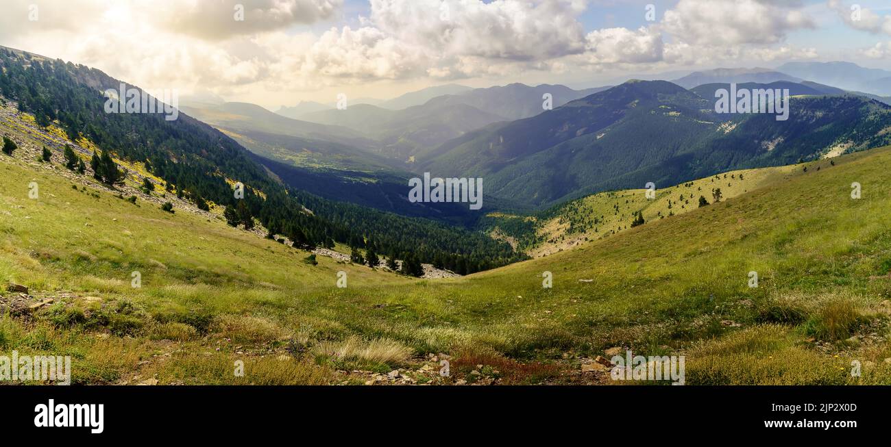 Aerial view of the high mountains of the Spanish Pyrenees in the Ordesa valley, majestic mountains with glimpses of the sun at sunset. Europe, Stock Photo