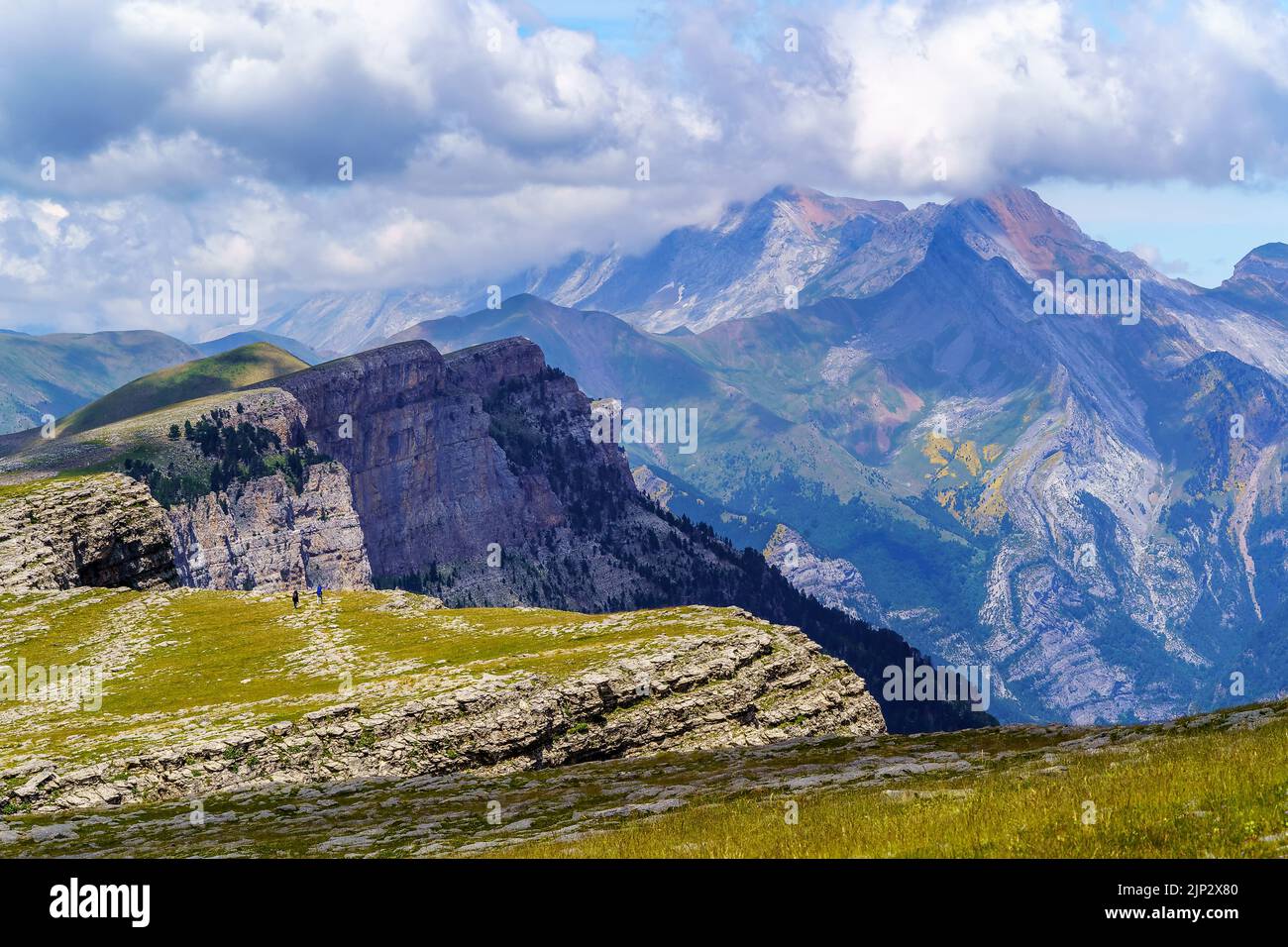 Green landscape with high mountains, green valleys, rocks and forests with blue sky and white clouds. Spanish Pyrenees, Ordesa Valley and Monte Perdid Stock Photo