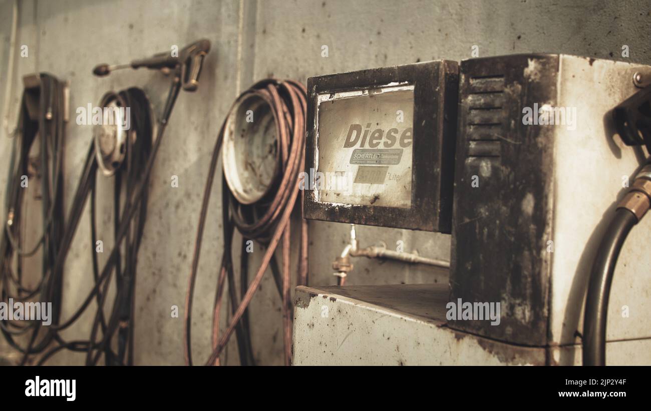 A closeup shot of a rustic diesel pump in an old retro gas station in Germany Stock Photo