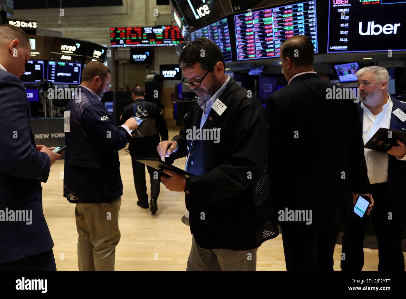 Traders work on the floor of the New York Stock Exchange (NYSE) in New York City, U.S., August 15, 2022.  REUTERS/Brendan McDermid Stock Photo