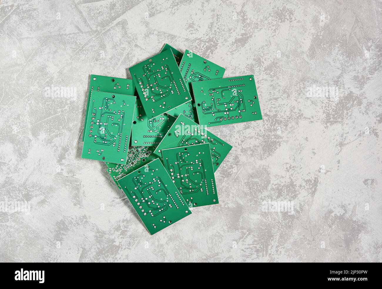 Electronic printed circuit boards on a light background. Recycling of