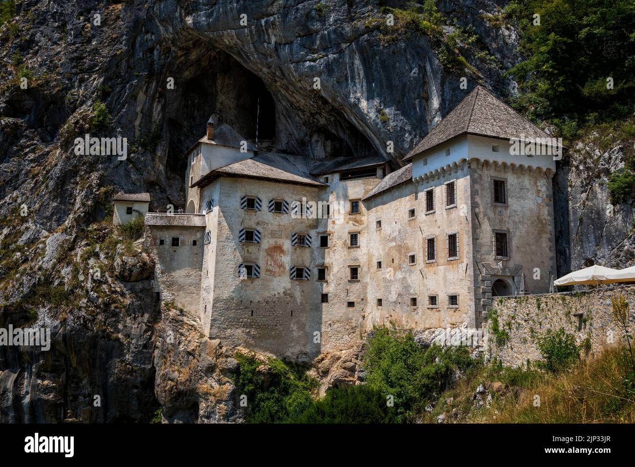 The Predjama Castle in Slovenia. Medieval cave castle in cliff with network of secret tunnels. Stock Photo