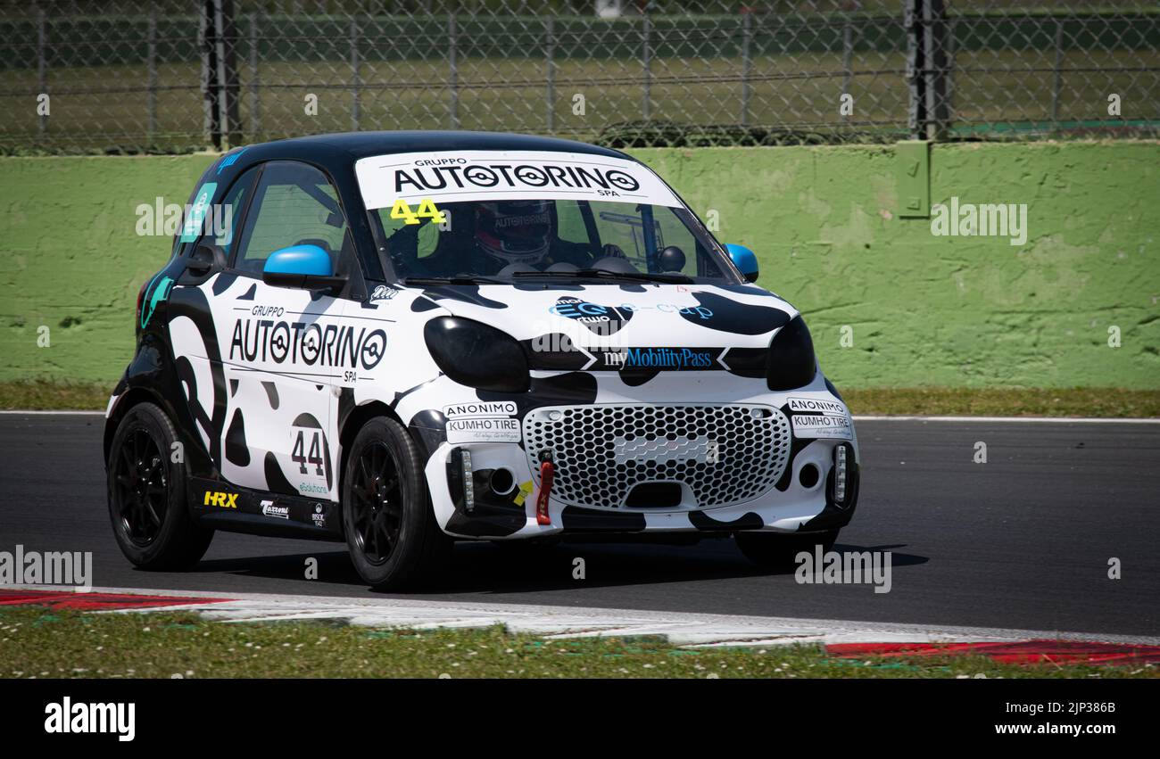 Racing Smart electric mini car action challenging on racetrack. Vallelunga, Italy. April 30 2022, Racing weekend Stock Photo