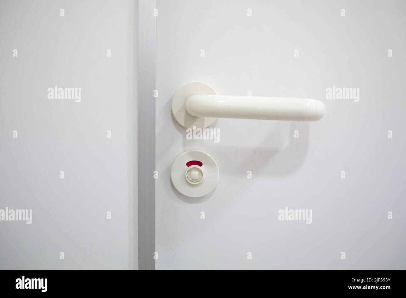 A bathroom door handle showing that it is occupied Stock Photo Alamy