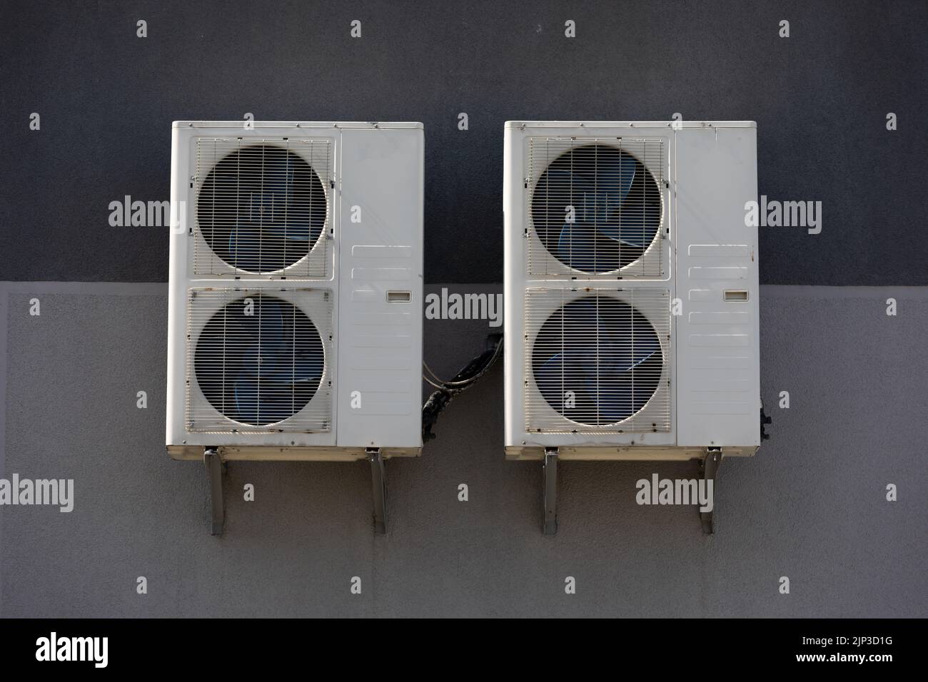 outdoor air conditioner unit with heat exchanger hanging outside the