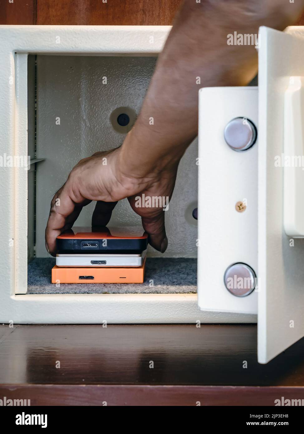 Security external hard drive in open metal safe. External hard disk