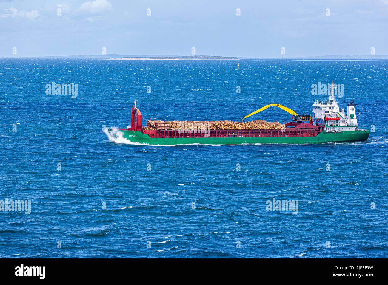 The general cargo ship St Pauli with a load of timber logs sailing in choppy seas in the Kattegat off the coast of Denmark Stock Photo