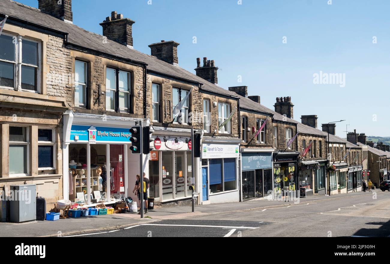 Shops and other businesses along Union Rd, in New Mills, Derbyshire, England, UK Stock Photo