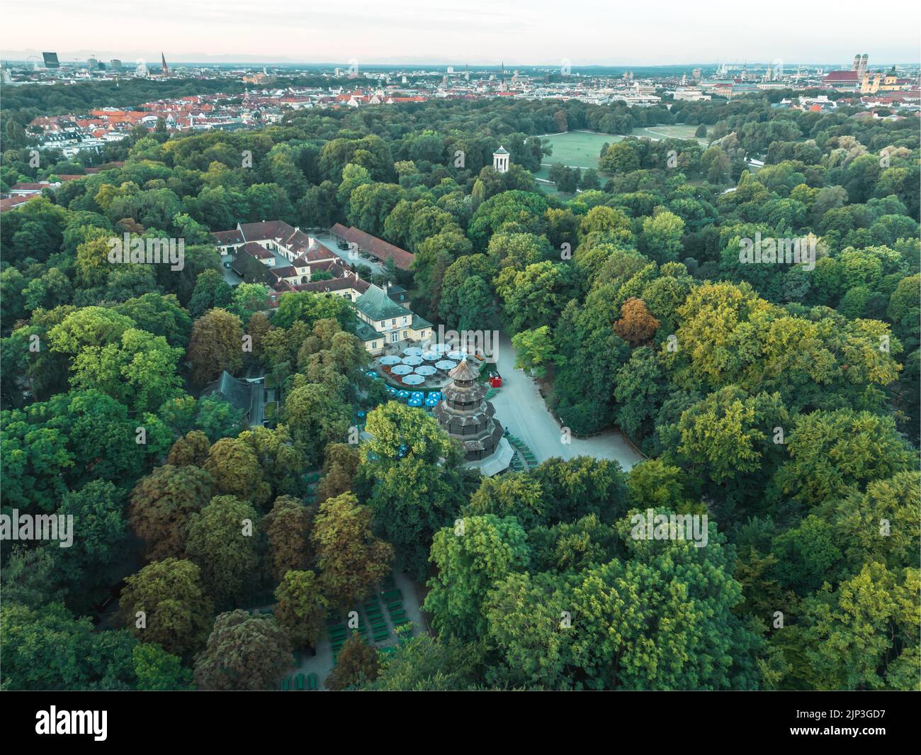 Aerial view of Chinese tower in Munich city park. Large central beer garden in English garden, popular summer destination for tourists and residents. Stock Photo