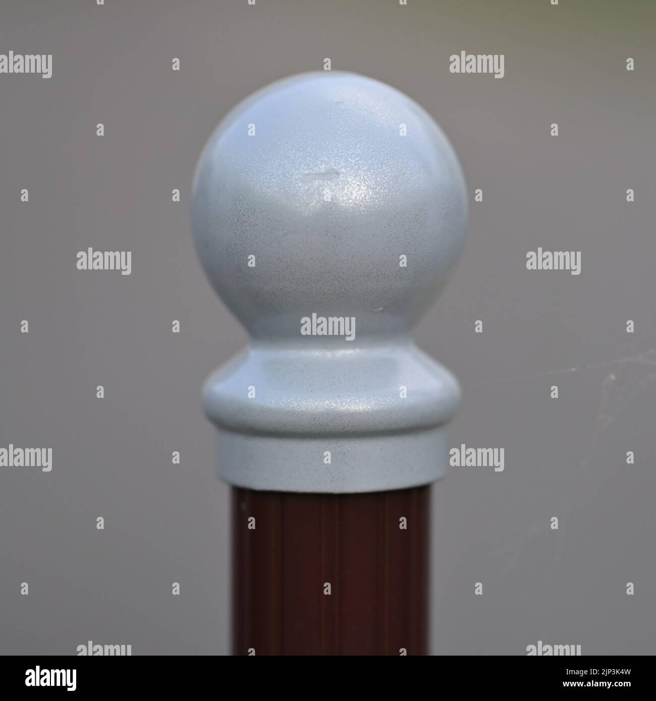 A white round tip of a signal post or a barrier Stock Photo - Alamy
