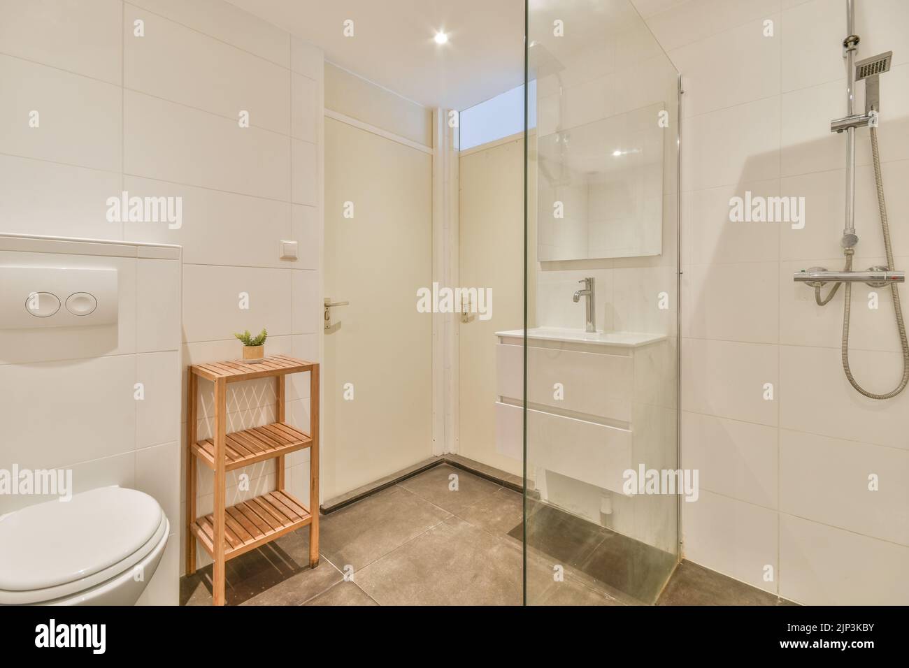 Modern home interior design of white bathroom with open bathtub and