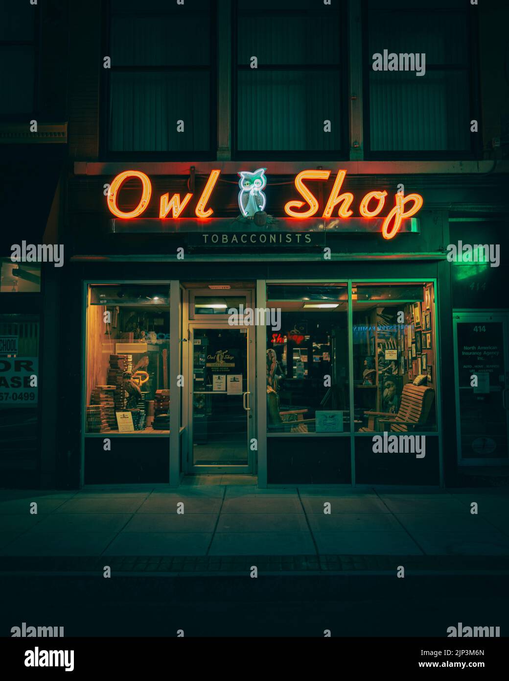 The Owl Shop neon sign at night, Worcester, Massachusetts Stock Photo