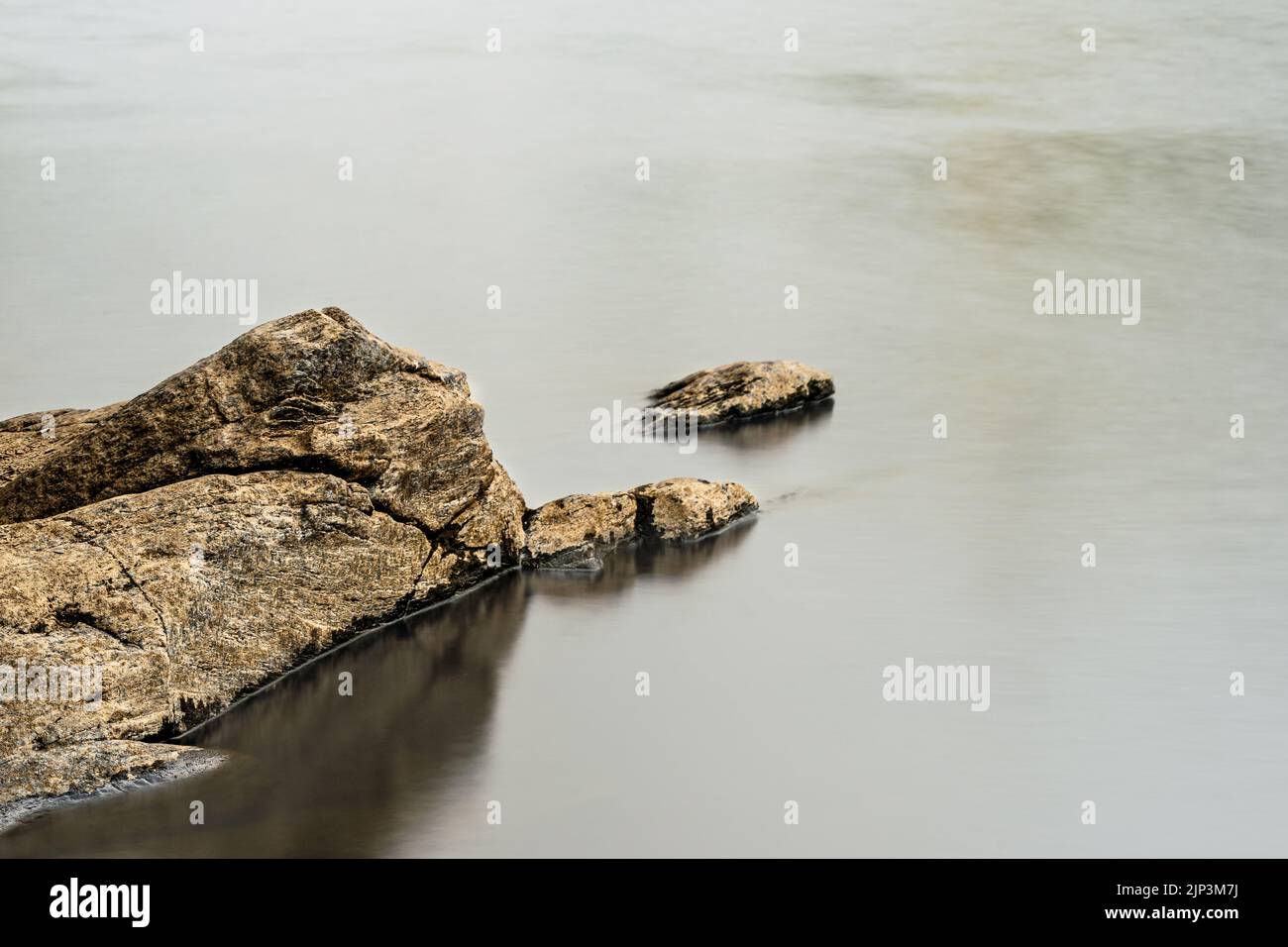 Long exposure of a river with silk effect in the water, with the rocks