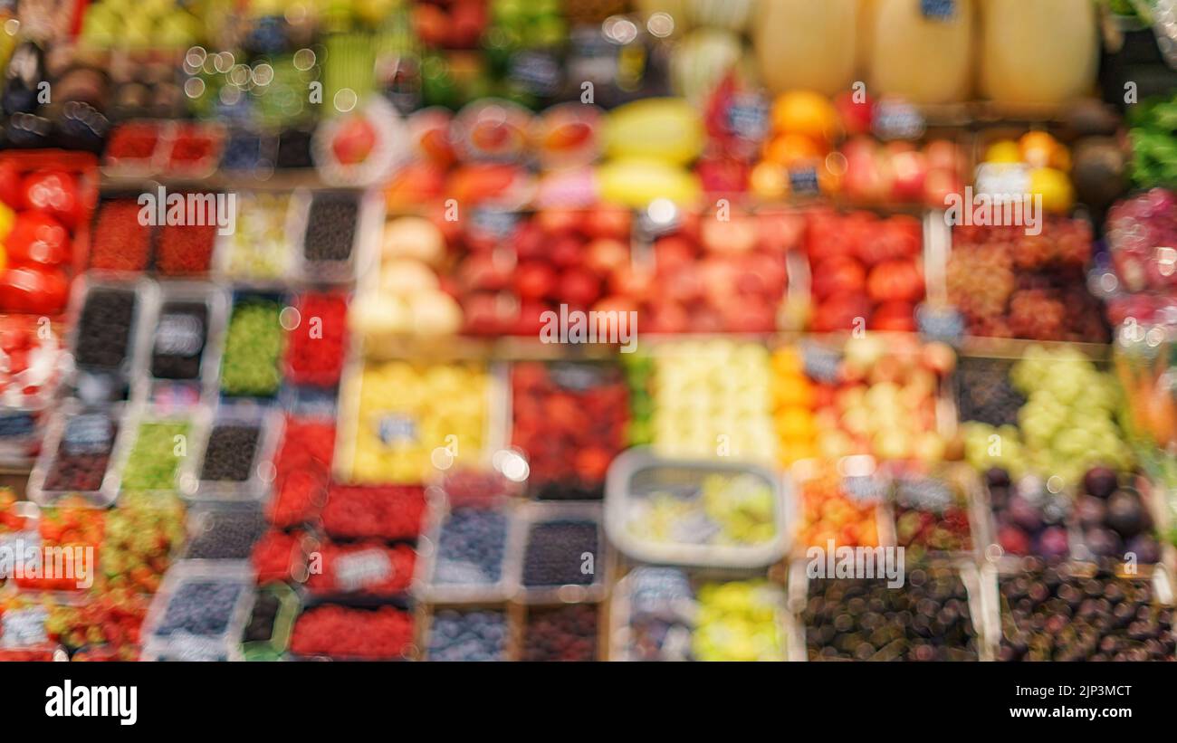Stall on vegetables market front defocused view. Vegetables theme defocused texture and background Stock Photo