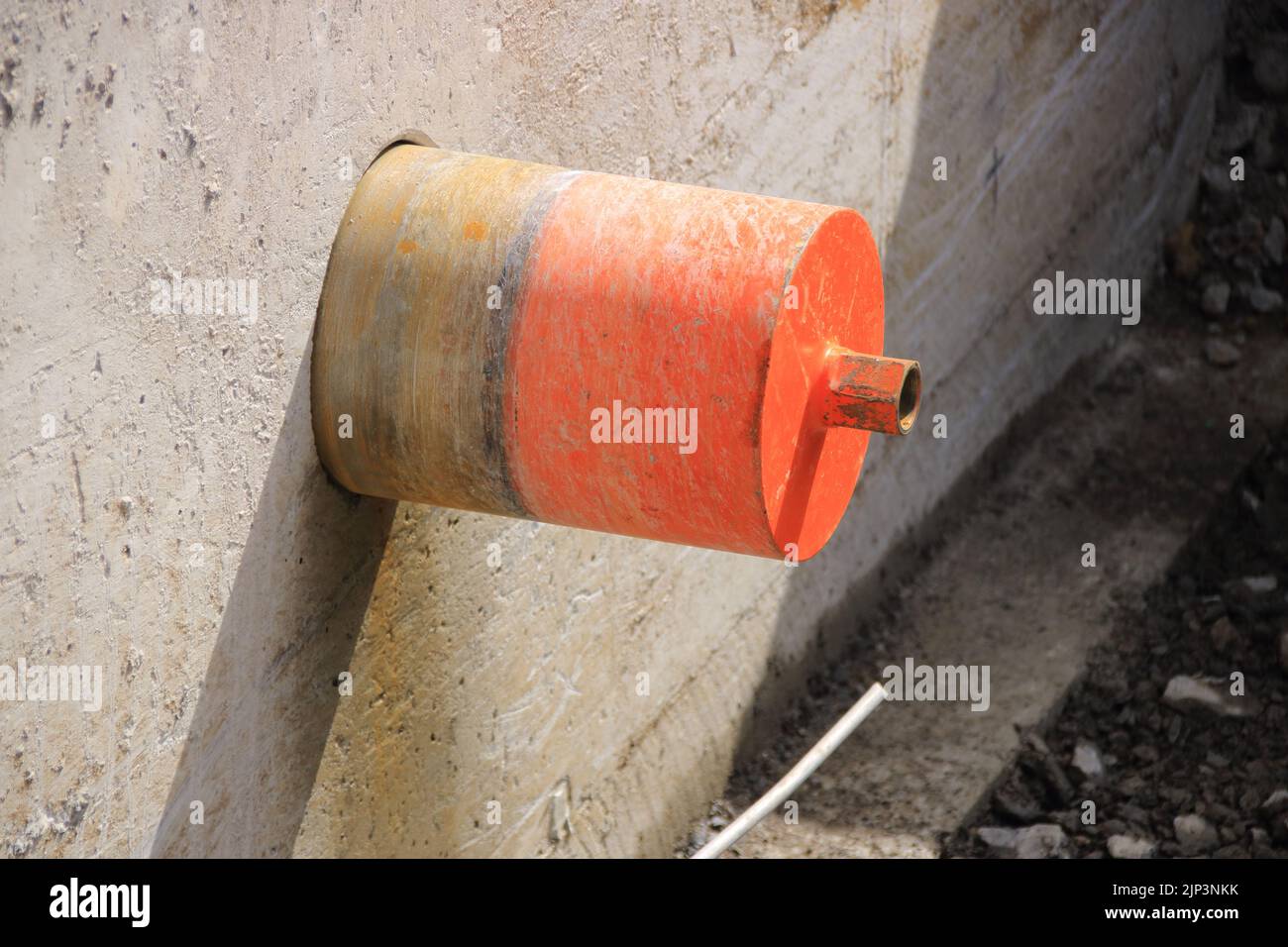Drill bit from a core hole is stuck in the wall Stock Photo Alamy