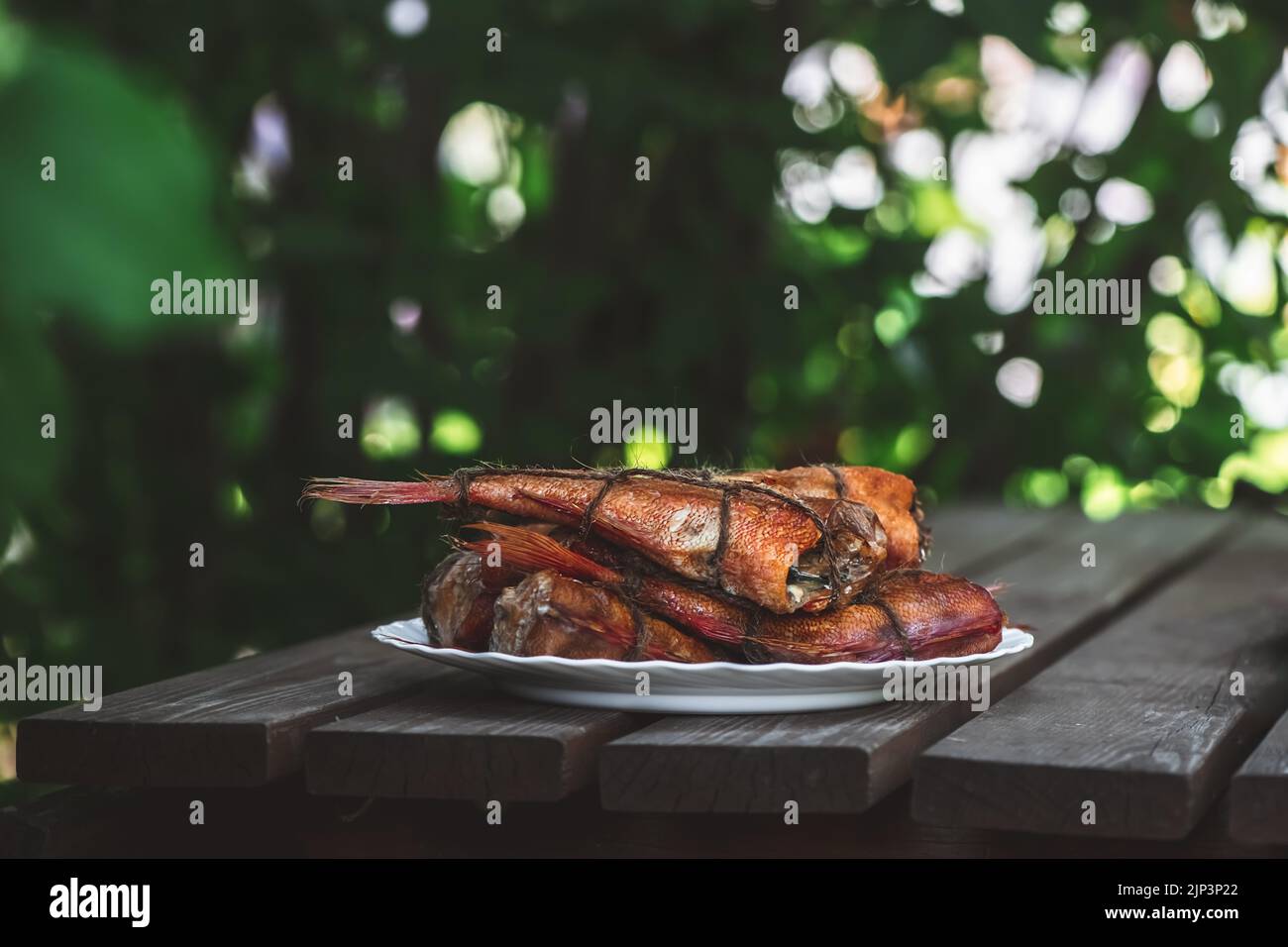 smoked fish sea bass on the table. homemade smoking Stock Photo Alamy