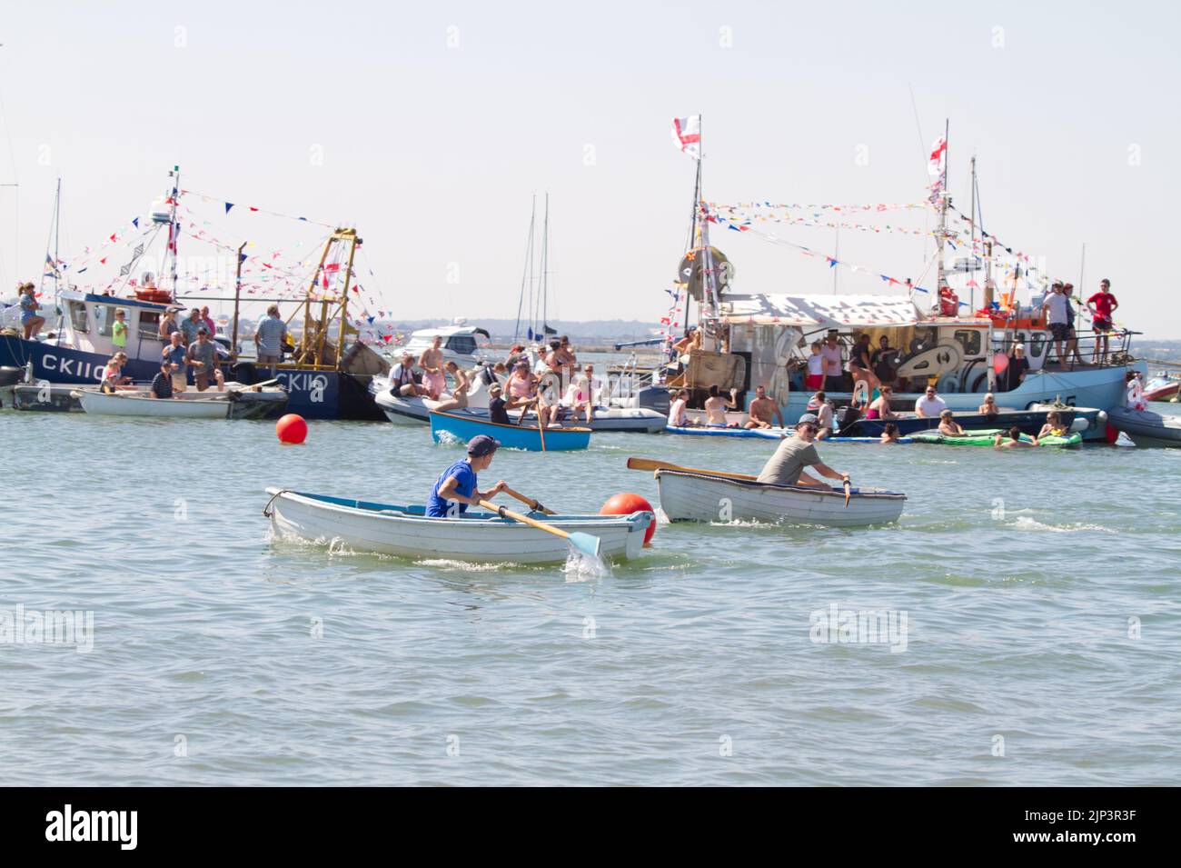 West Mersea Town Regatta on Mersea Island in Essex. One of the rowing races. Stock Photo