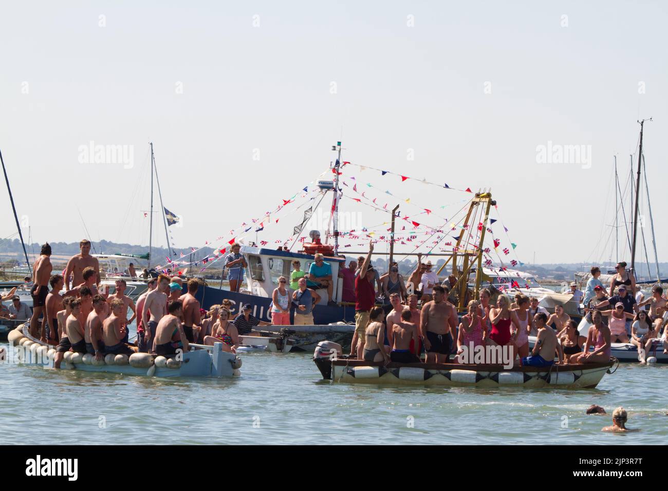 West Mersea Town Regatta on Mersea Island in Essex. Boats are full of