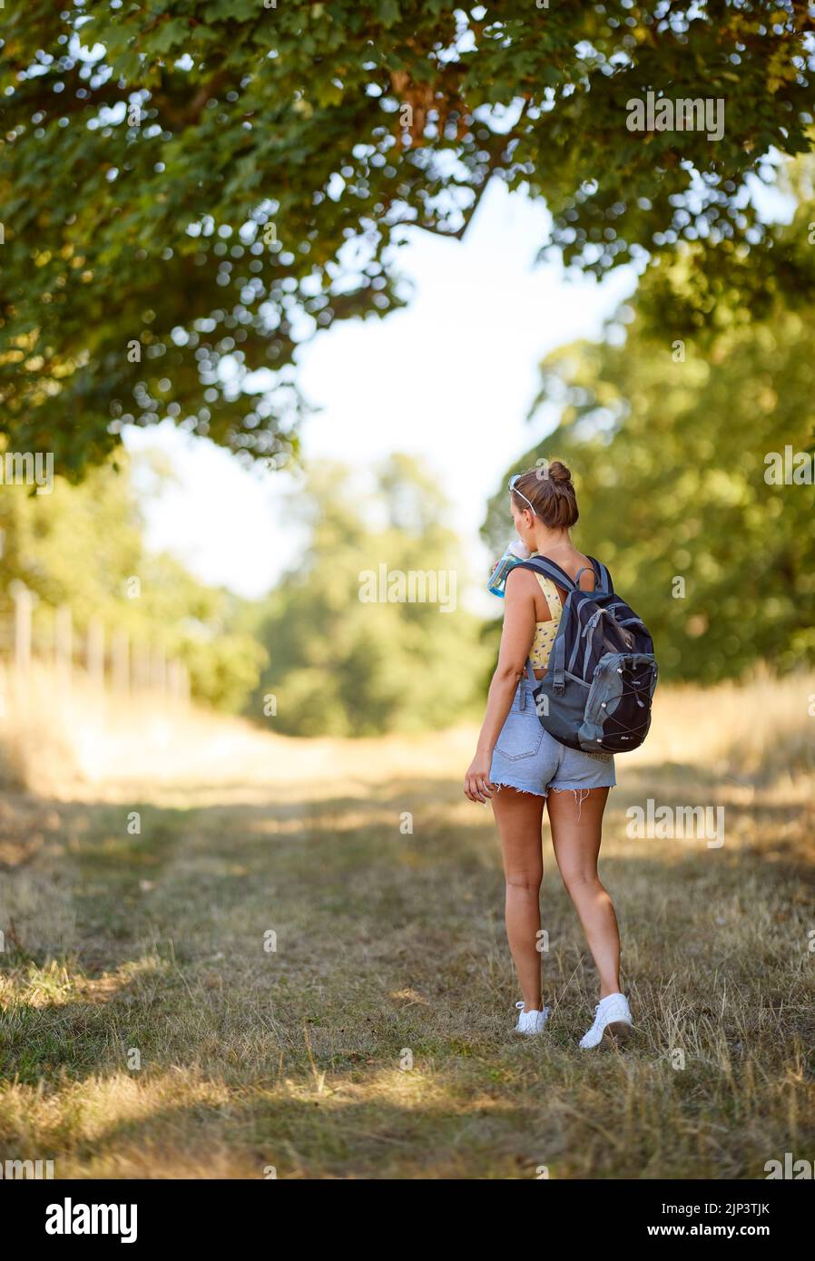 Woman walking outdoors in the countryside Stock Photo