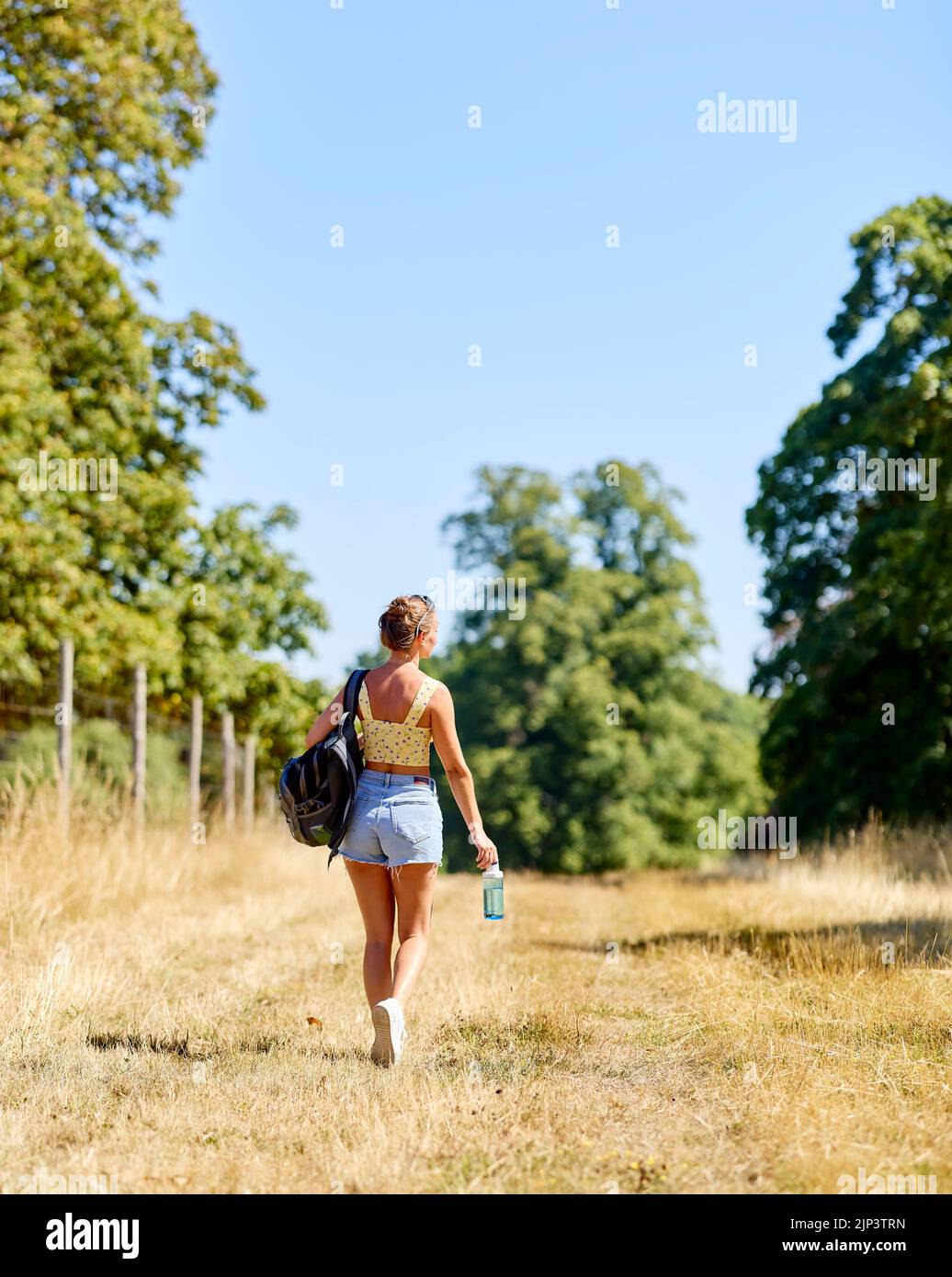 Woman walking outdoors in the countryside Stock Photo