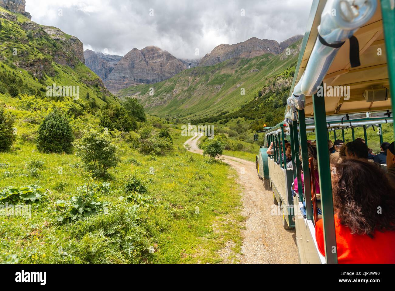 A mountain train with many tourists heading to the Ripera valley in the town of Panticosa Stock Photo