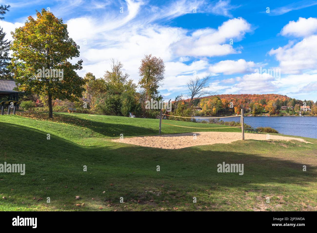 Sand volleyball court in a deserted lakeside park on a clear autumn day Stock Photo