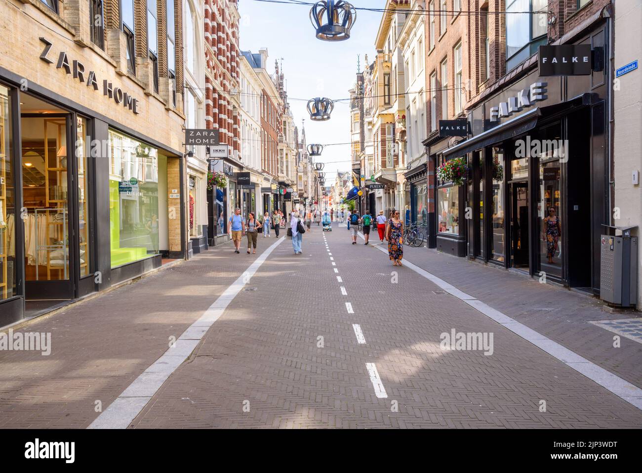 The Hague, Netherlands - June 17, 2022: People stolling along Noordeinde street on a sunny day Stock Photo