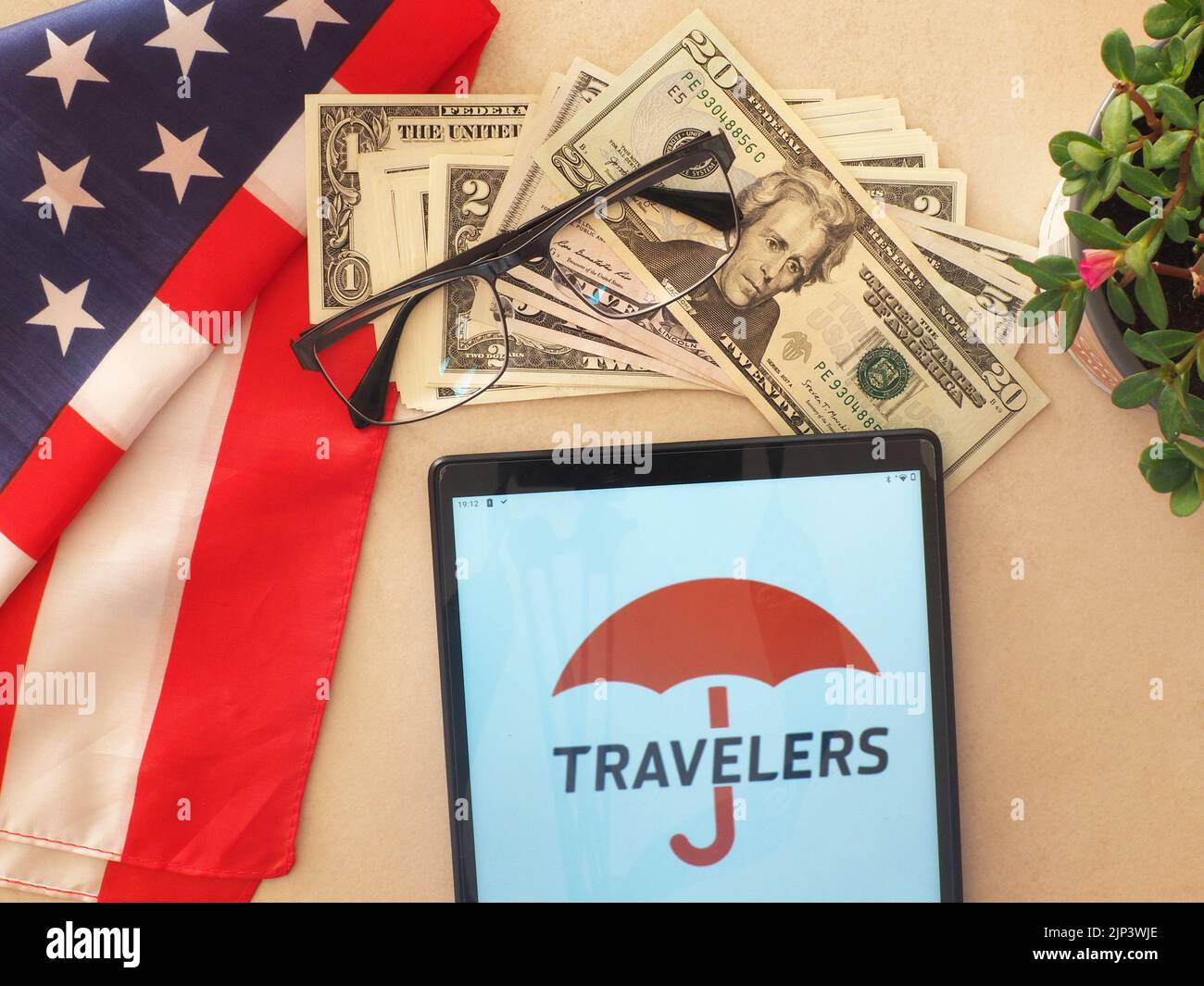 In this photo illustration, The Travelers Companies logo seen displayed on a tablet Stock Photo