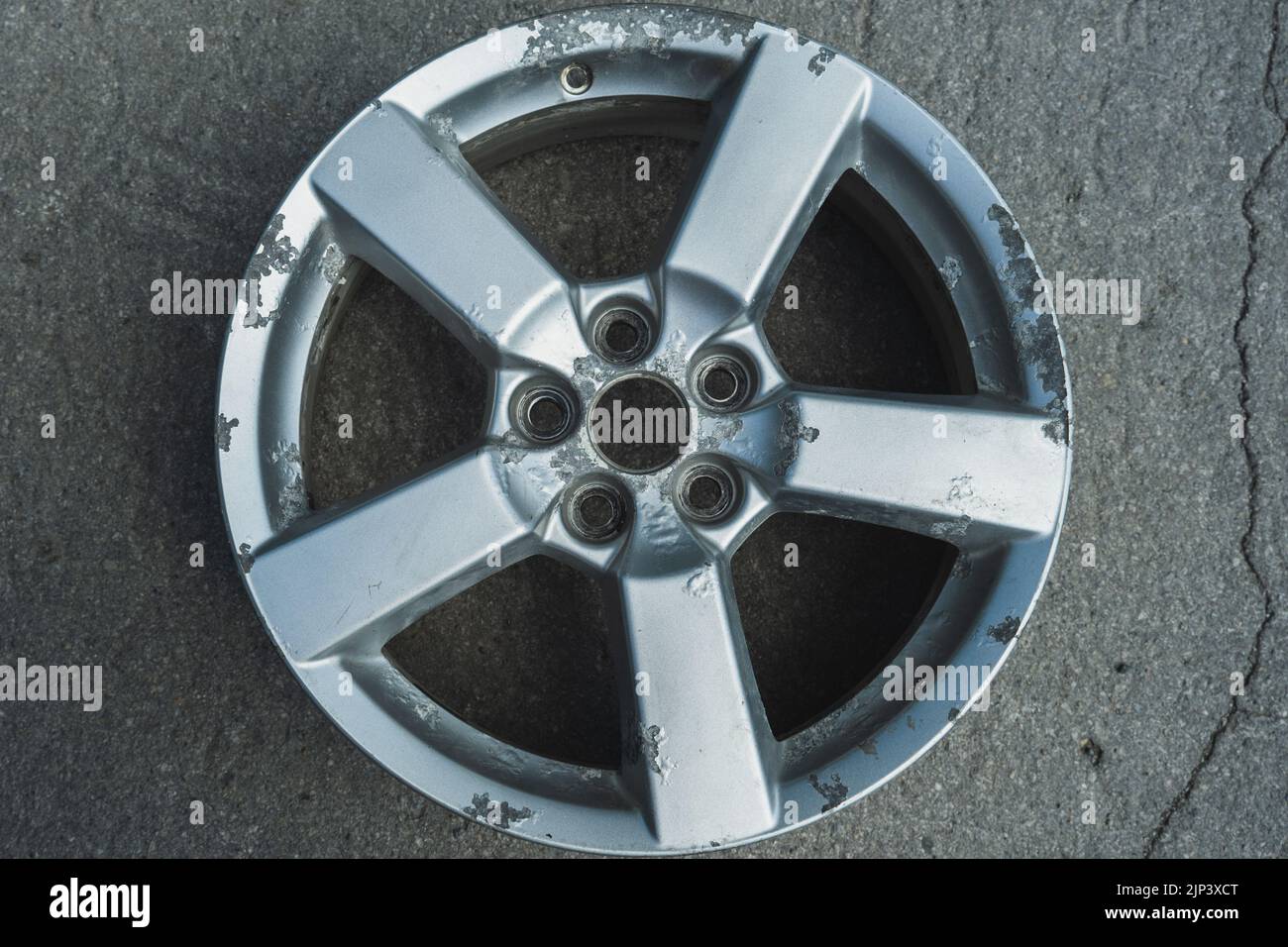 Corrosion on a silver aluminum alloy wheel close-up Stock Photo