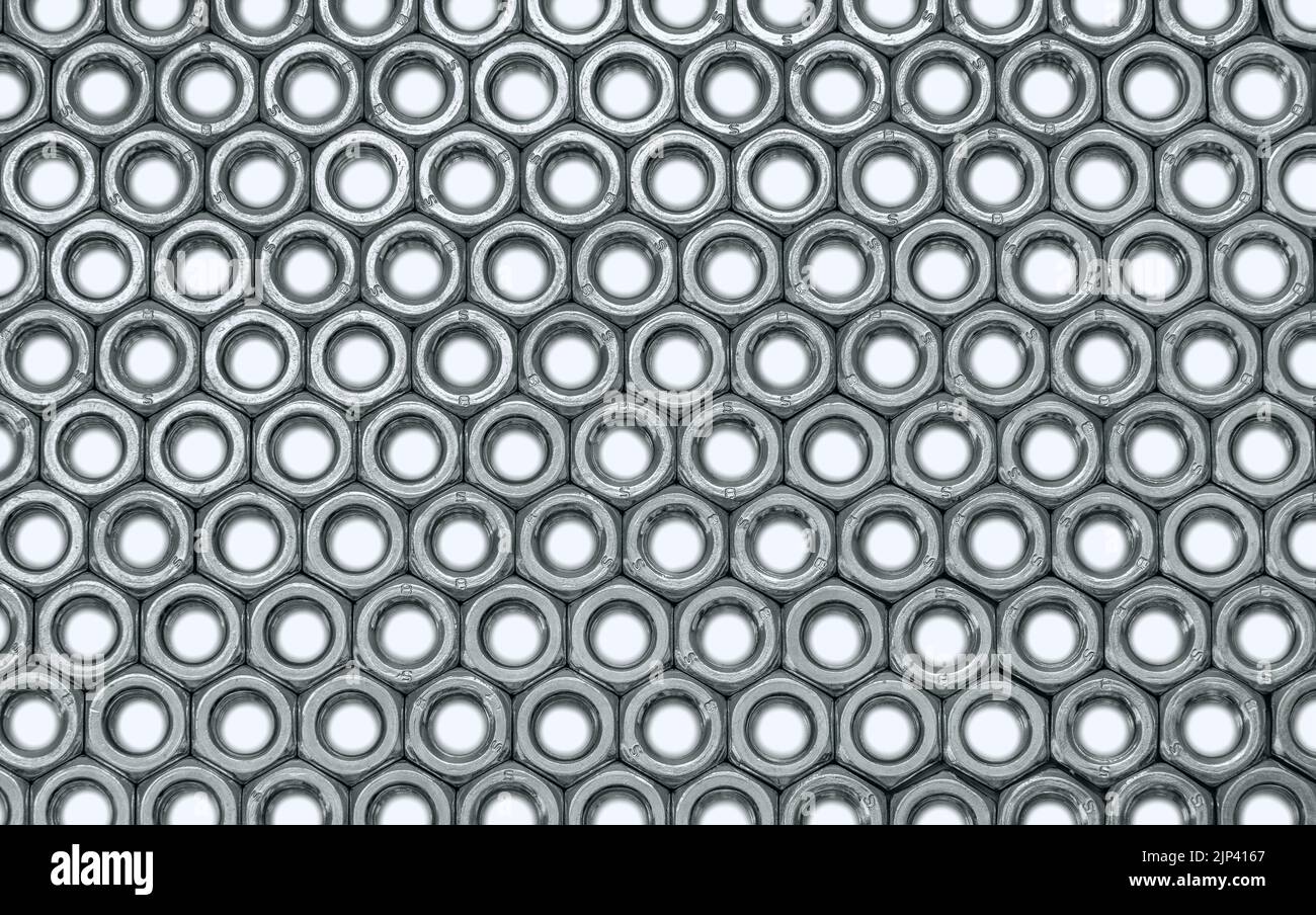 Metal nuts in a row background Stock Photo