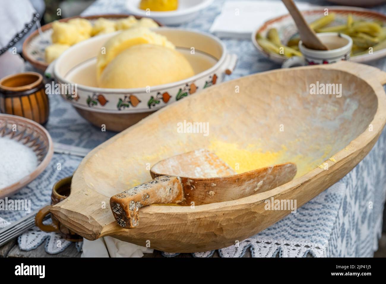 old wooden spoon in the hominy bowl Stock Photo - Alamy