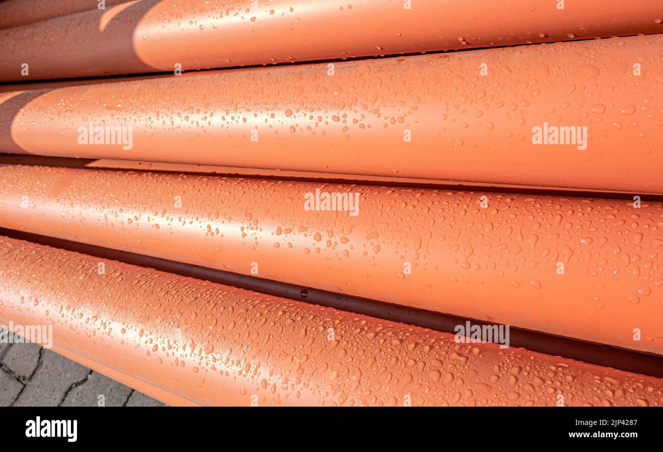 Stack of Orange pipe made of polyvinyl chloride Stock Photo Alamy