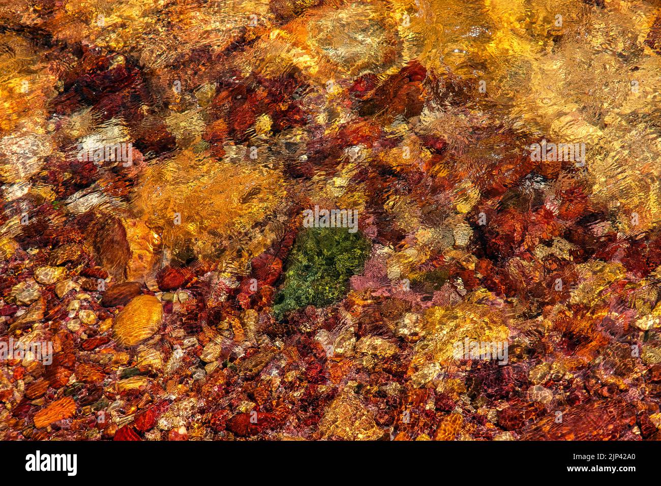 smooth clear water float on colored stone Stock Photo Alamy