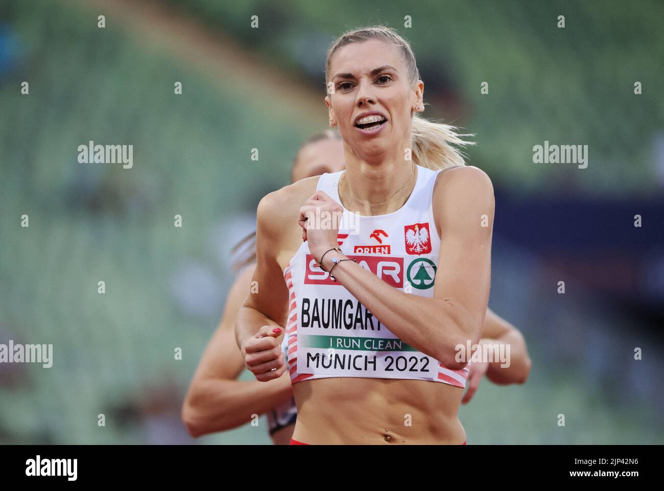 Athletics - 2022 European Championships - Olympiastadion, Munich, Germany - August 15, 2022 Poland's Iga Baumgart-Witan reacts after winning the women's 400m Round 1 Heat 2 REUTERS/Wolfgang Rattay Stock Photo
