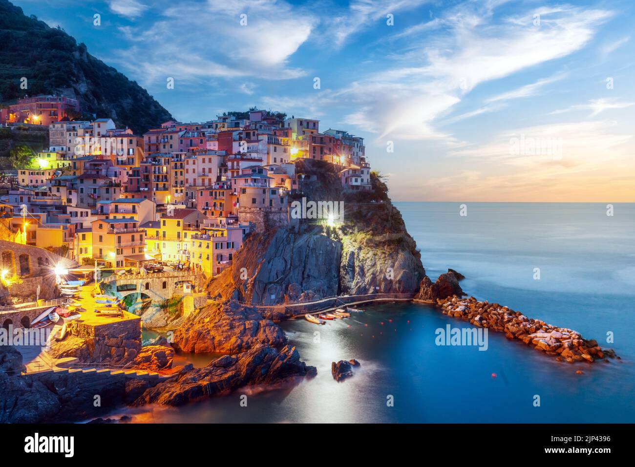 Incredible morning view of Manarola city with costal rocks on a foreground. Cinque Terre National Park, Liguria, Italy, Europe. Landscape photography Stock Photo