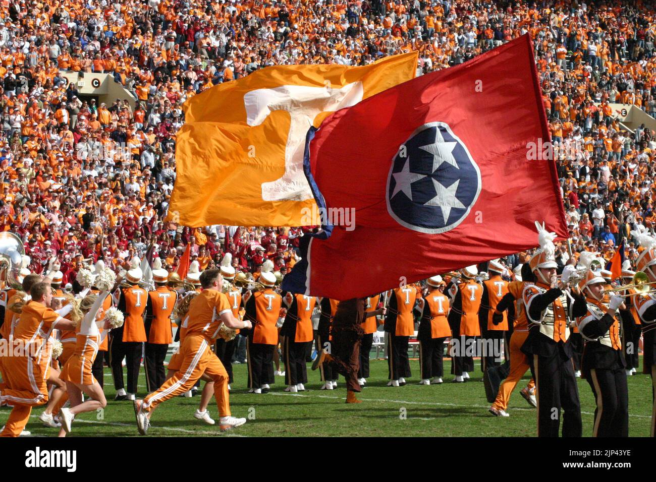 Cheerleaders run through the 'T' moments before a University of Tennessee football game at Neyland Stadium in Knoxville, Tennessee. Stock Photo