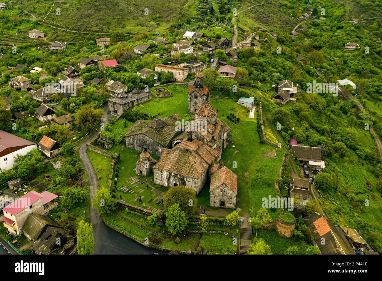 A drone shot of the Haghpat Monastery with the surrounding villages in Haghpat, Armenia Stock Photo